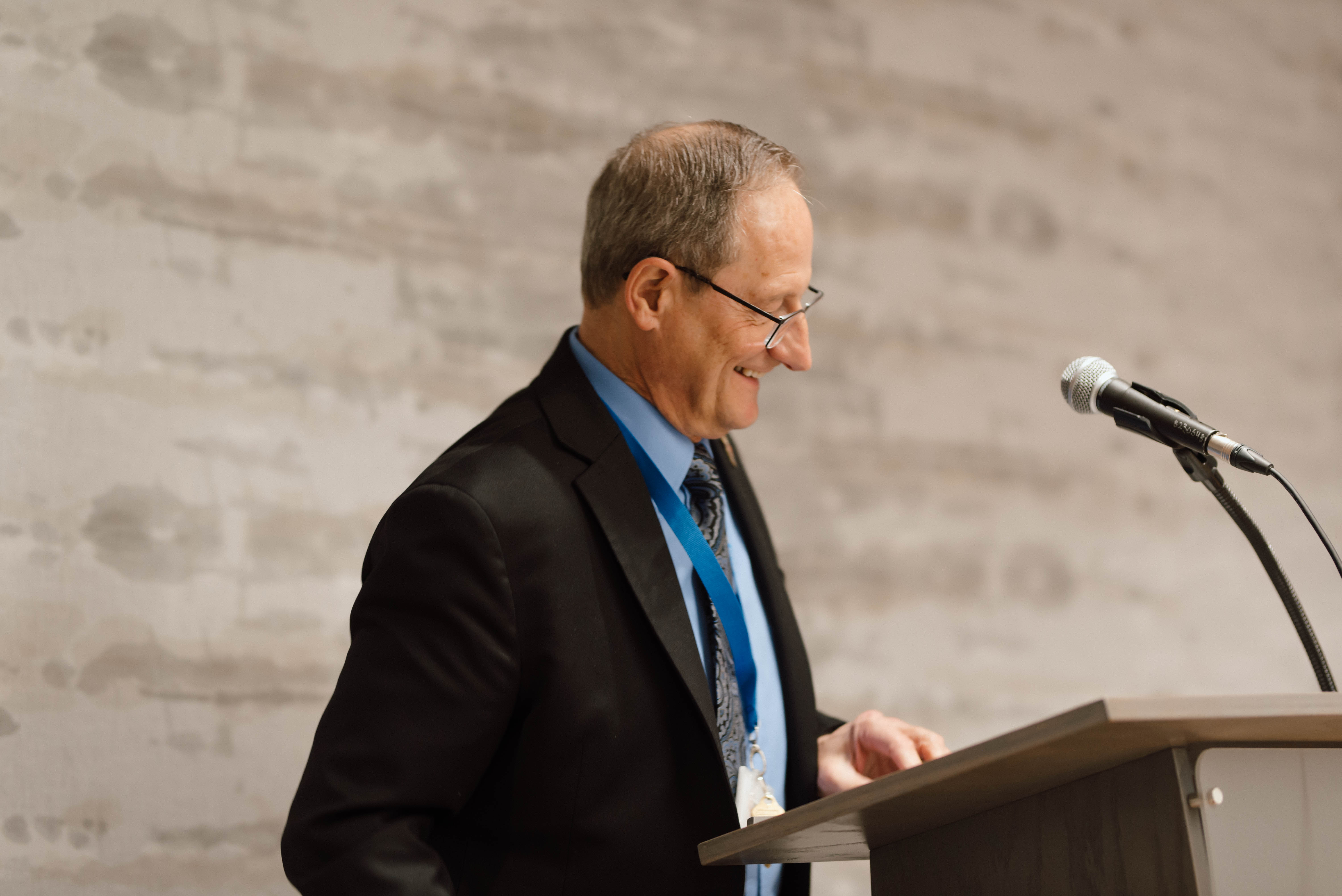 Deputy Chairperson, Jacques Bouchard, speaking at a podium.
